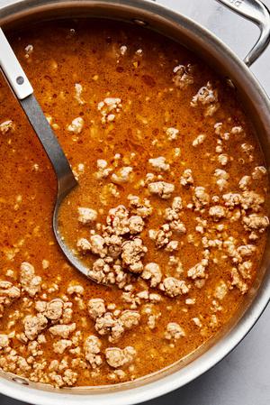 pork, spices, soy sauce, sherry, chicken stock, peanut butter, Sichuan peppercorns, sugar & chili paste in a skillet