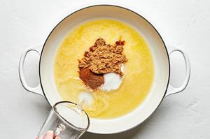 butter, flour, sugar, brown sugar, lemon juice, water, cinnamon and nutmeg being combined in a skillet