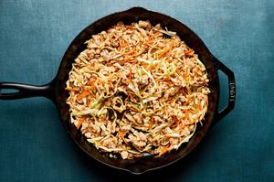 egg roll in a bowl being cooked in a skillet made with ground turkey, onion, ginger, garlic, cabbage, carrots and soy sauce