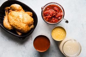 ingredients laid out for 5 ingredient chicken tortilla soup stock, rotisserie chicken, canned tomatoes enchilada sauce