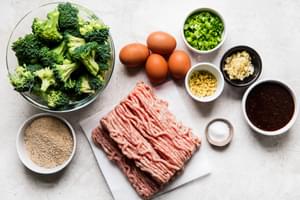 Ingredients laid out for chicken teriyaki meatballs eggs, salt, bread crumbs, garlic