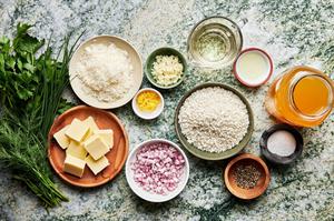 stock, shallot, butter, garlic, arborio rice, wine, lemon juice & zest, fresh herbs, parmesan, salt & pepper in prep bowls