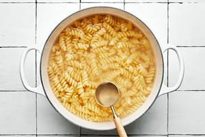 fussili pasta noodles boiliing in salted water