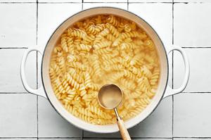 fussili pasta noodles boiliing in salted water