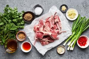 Raw lamb chops, salt, garam masala, garlic, ginger, olive oil, brown sugar, green onions, mint, cilantro, chiles and vinegar