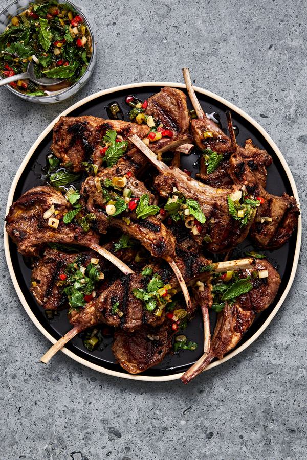 Garam Masala Grilled Lamb Chops on a serving plater next to a small bowl filled with Mint Chutney