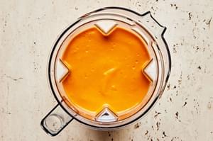 gazpacho soup in a blender made with Roma tomatoes, bell pepper, cucumber, onion, garlic, olive oil, sherry, salt, and pepper
