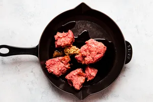 ground beef, olive oil and brown sugar in a cast iron skillet
