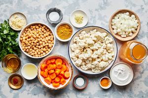 chickpeas, carrots, cauliflower, onion, chicken stock, coconut milk, lemon juice, sugar and spices in prep bowls