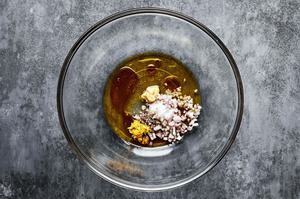 olive oil, vinegar, shallot, Dijon, honey, lemon zest, salt, and pepper in a mixing bowl