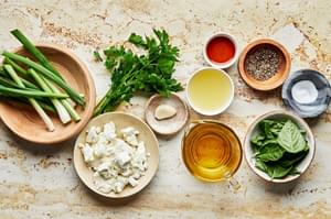goat cheese, olive oil, green onions, basil, parsley, garlic, fish sauce, lemon juice, pepper, and salt in prep bowls
