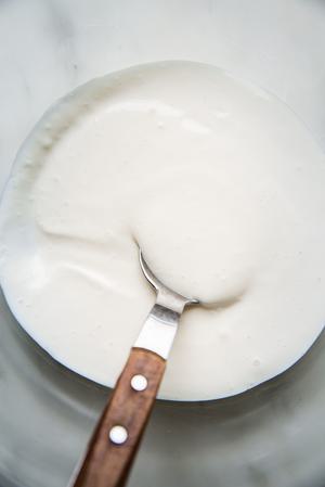 cream sauce for tilapia tacos in a small bowl mayonnaise, milk and lime juice