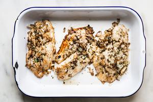 Grilled tilapia fish that has been marinated in lime, orange, onion, garlic, cilantro and oregano