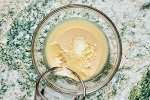 tahini, lemon juice, garlic, water, and salt in a glass bowl to make tahini sauce