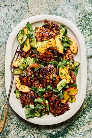 grilled honey mustard chicken topped with peach salad on a serving platter