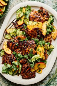 grilled honey mustard chicken topped with peach salad on a serving platter