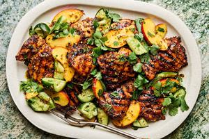 grilled honey mustard chicken topped with peach salad on a serving platter
