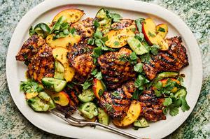 grilled honey mustard chicken topped with peach salad on a serving platter