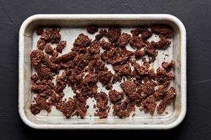 rye breadcrumbs on a baking that have been broiled until crispy