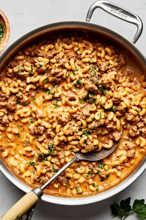 a pan of homemade hamburger helper made with pasta, ground beef, milk, butter, beef stock, cheese and spices