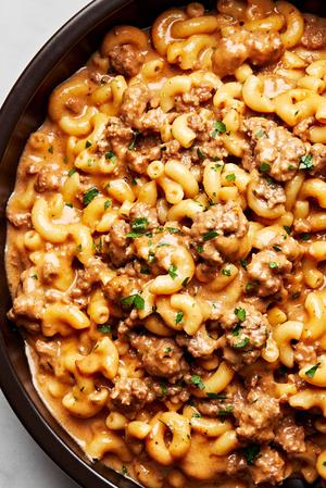 a pan of homemade hamburger helper made with elbow macaroni, ground beef, milk, butter, beef stock, cheese and spices