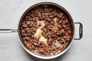 ground beef, tomato paste, garlic powder, onion powder, Italian seasoning, chili powder, sugar, mixed together in a skillet