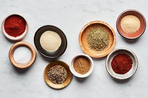 chili powder, paprika, cumin, onion powder, garlic powder, oregano, salt & pepper in prep bowls to make taco seasoning