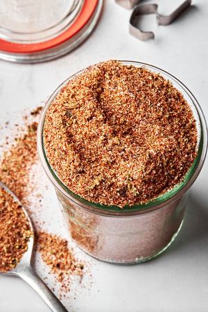 a jar of homemade taco seasoning made with chili powder, paprika, cumin, onion powder, garlic powder, oregano, salt & pepper