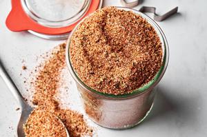 a jar of homemade taco seasoning made with chili powder, paprika, cumin, onion powder, garlic powder, oregano, salt & pepper