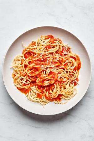 homemade tomato sauce served on top of spaghetti noodles