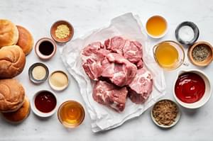 pork shoulder, buns, brown sugar, honey, chipotle peppers, worcestershire, spices, stock & apple cider vinegar in prep bowls