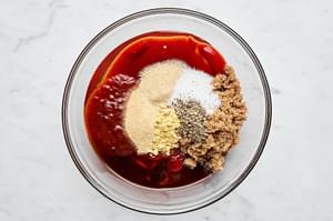 ketchup, brown sugar, honey, chipotle chiles, Worcestershire, mustard powder, garlic & onion powder, salt & pepper in a bowl