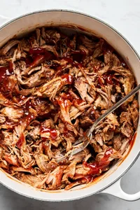 homemade honey chipotle pulled pork being stirred in a pot