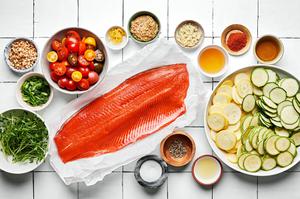 1 1/2 pound salmon fillet, sliced zucchini, squash, tomatoes, spices, pine nuts, and green onions in prep bowls