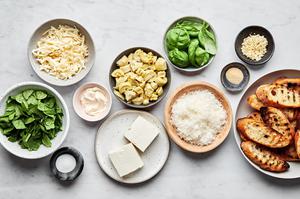 cream cheese, mayo, Parm, garlic, basil, garlic powder, salt, artichoke hears, spinach, mozzarella & crostini in prep bowls