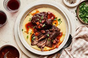 Italian Pot Roast served over creamy polenta sprinkled with fresh parsley