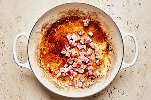 pancetta being cooked in a pot