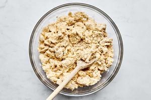 oat scone dough in a bowl made with butter, flour, baking soda, baking powder, salt, sugar, yogurt and oats