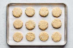 raw homemade oat scones on a parchment lined baking sheet