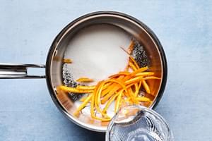 strips of orange zest, water and sugar in a small pot