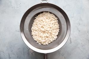 rinsed long grain white rice in a fine mesh sieve