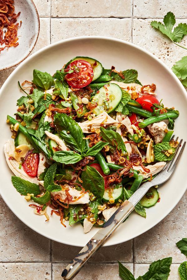 lemongrass chicken herb salad made with basil, mint, green beans, tomatoes, cucumbers and fried shallots