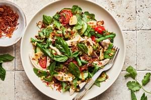 lemongrass chicken herb salad made with basil, mint, green beans, tomatoes, cucumbers and fried shallots