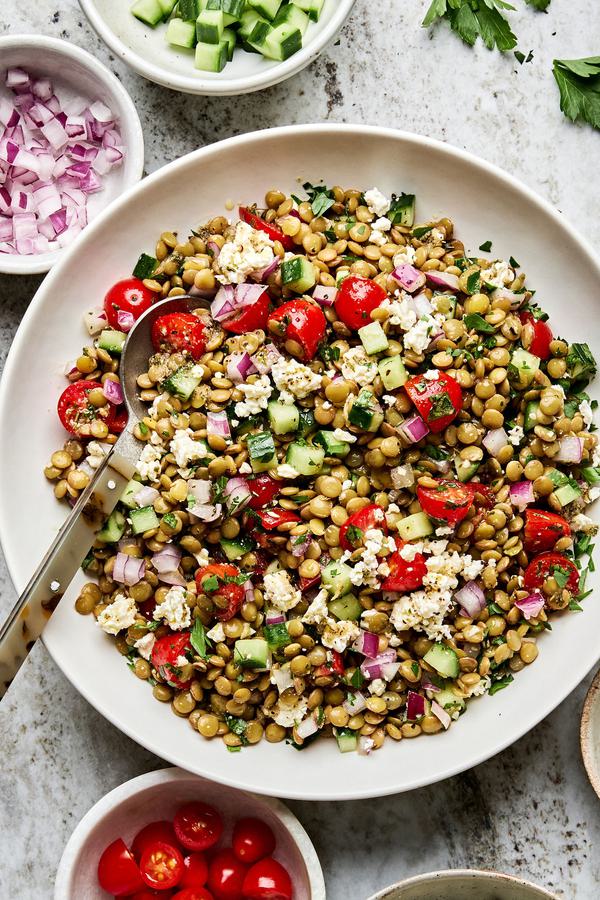 lentil salad made with cucumber, tomato, red onion, garlic, parsley, lemon juice, feta, olive oil, vinegar & spices