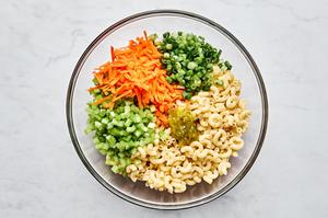 macaroni, carrots, relish, celery and green onions in a large bowl