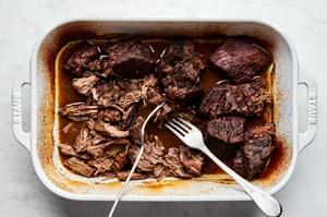 margarita beef being shred with two forks
