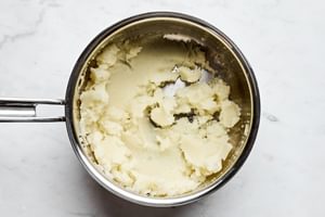 creamy mashed potatoes in a pot to be used for meat pie filling