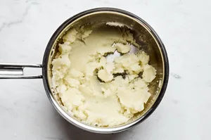 creamy mashed potatoes in a pot to be used for meat pie filling