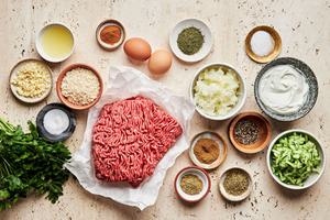 ground beef, onion, spices, parsley, eggs, bread crumbs, greek yogurt, cucumber and lemon juice in prep bowls