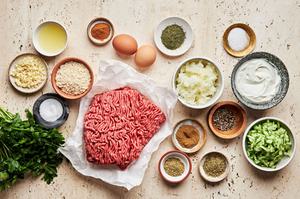 ground beef, onion, spices, parsley, eggs, bread crumbs, greek yogurt, cucumber and lemon juice in prep bowls